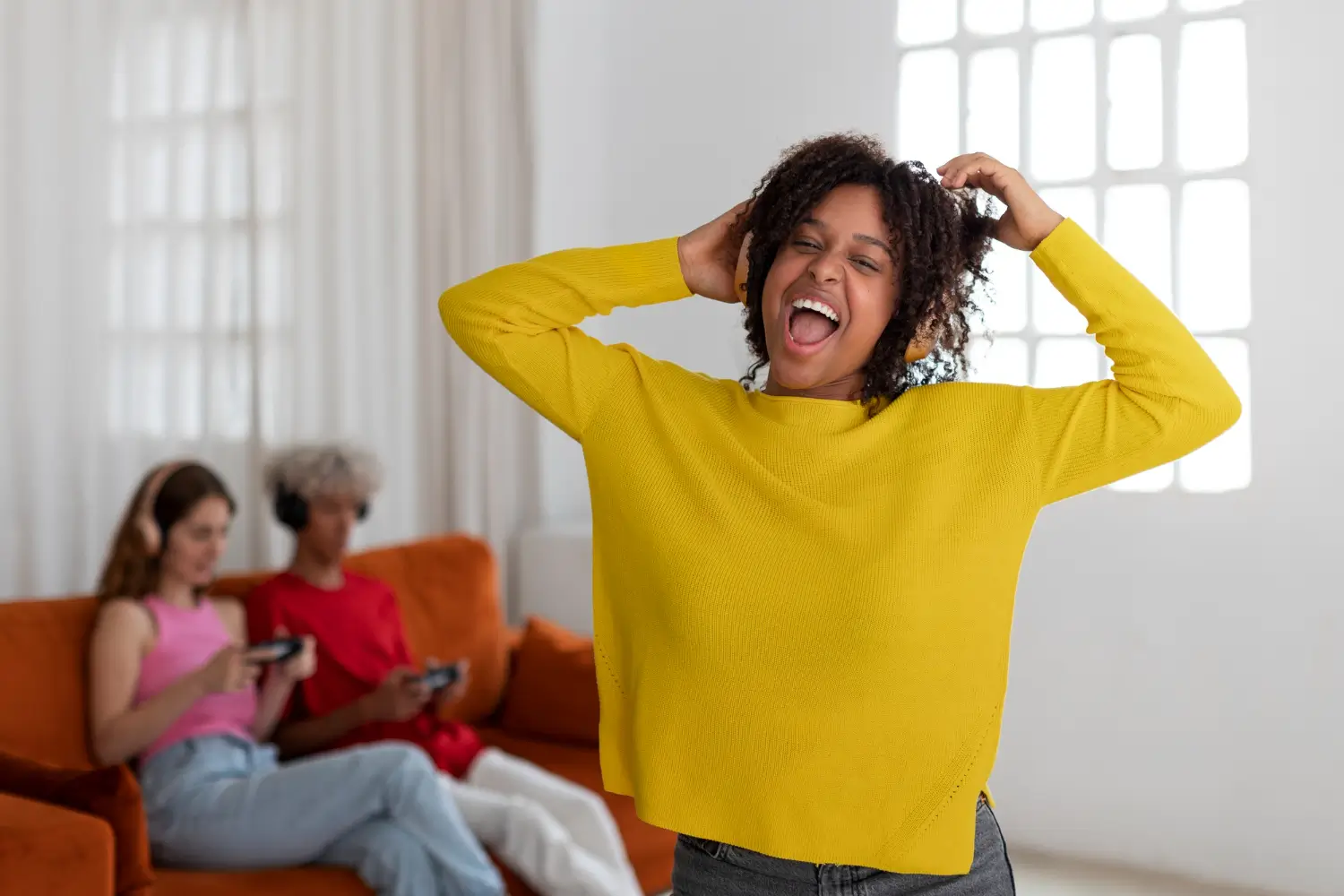 A young person sitting with a supportive family member