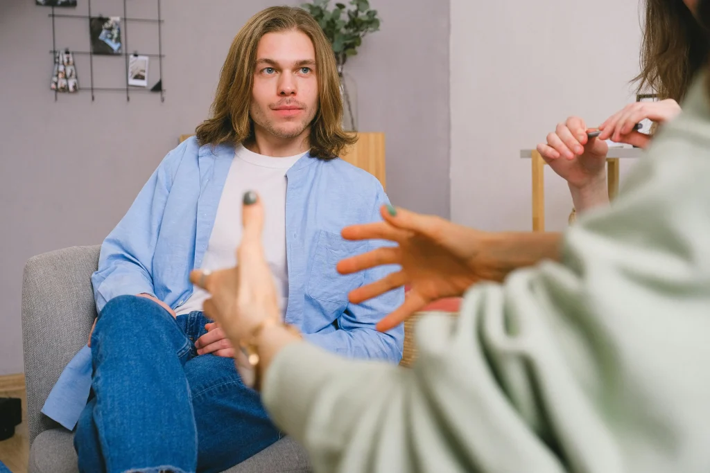Smiling person in a calm consultation setting